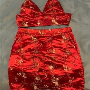Two piece red brawl let and mini skirt set